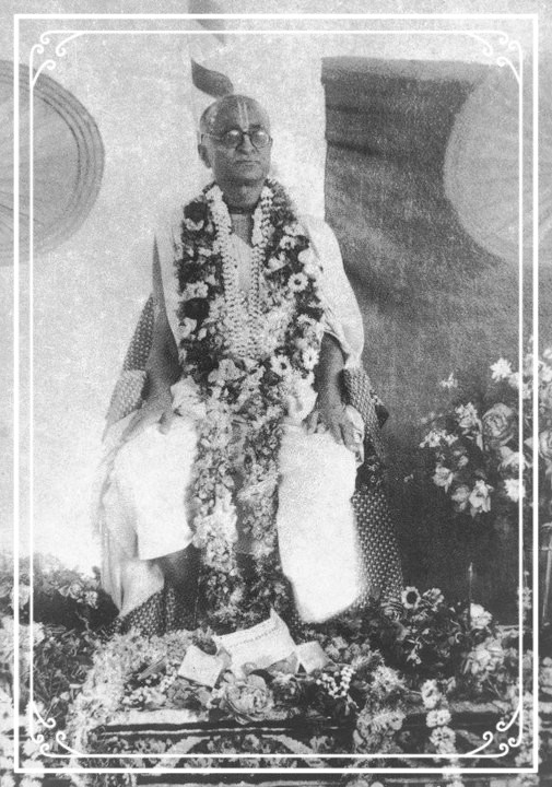 Bhagavan Srila Bhaktisiddhanta Saraswati Thakur with garlands